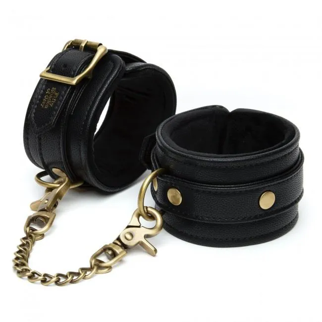 50 SHADES - MENOTTES POUR POIGNETS EN SIMILI CUIR 